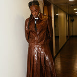 BAFTA Awards 2026 Cat Burns Brown Jacket